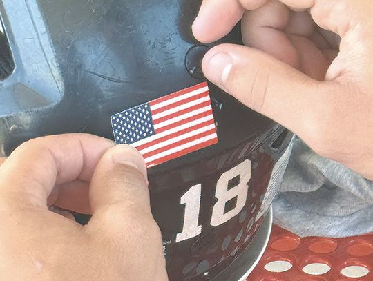 Bulldog football helmets featuring U.S. flag decal